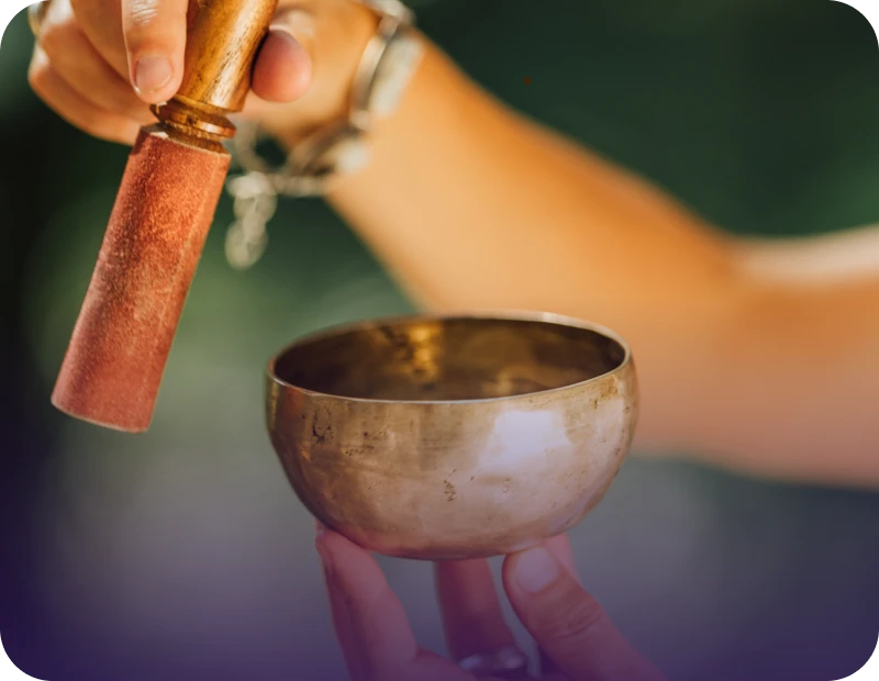 Person using a Tibetan singing bowl