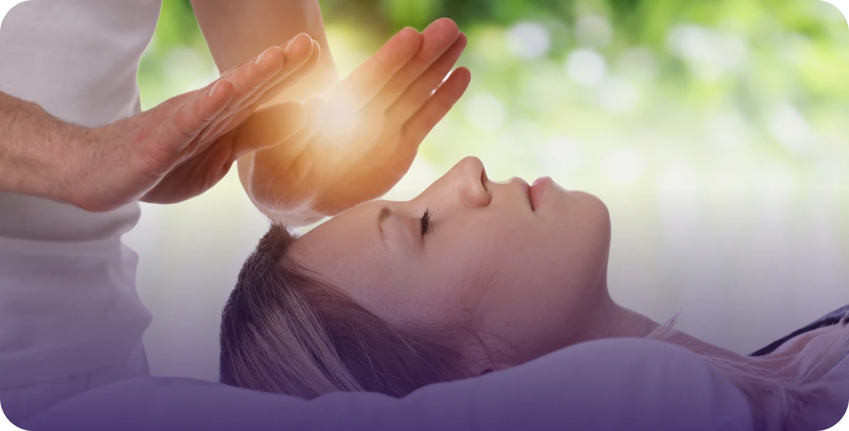 Reiki healing session with glowing hands